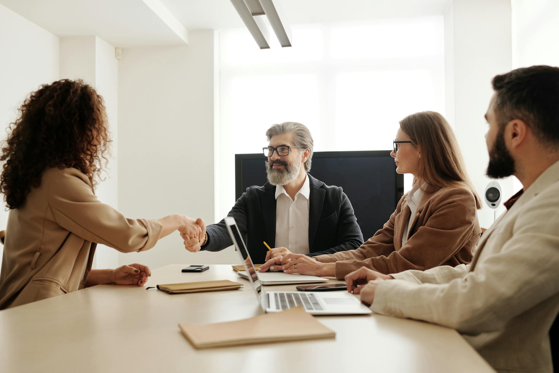 Business partnership handshake